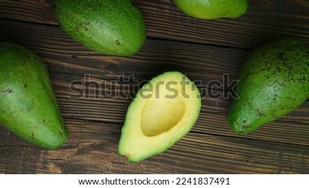 Flatlay avocado slice with wooden background, selective focus