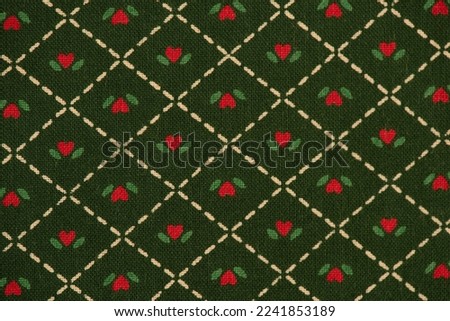 Heart shape pattern part of the old japanese fabric on green background.