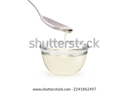 Sugar syrup in glass bowl isolated on white background  Royalty-Free Stock Photo #2241862497