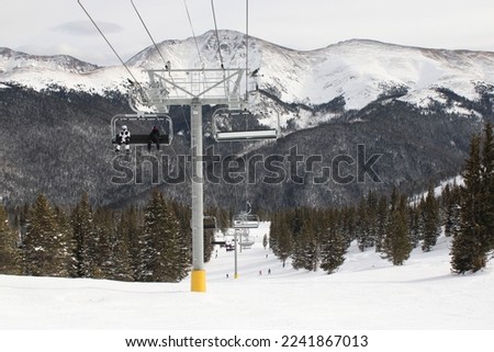 Snowy but sunny and beautiful day at Winter Park, Colorado. Breathtaking views from a ski resort in central Colorado.