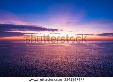 Aerial view sunset sky, Nature beautiful Light Sunset or sunrise over sea, Colorful dramatic majestic scenery Sky with Amazing clouds and waves in sunset sky purple light cloud background Royalty-Free Stock Photo #2241867699