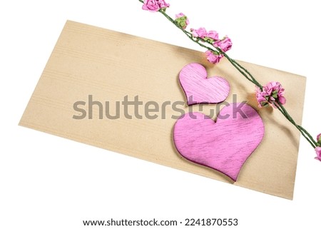 Red heart and flower stem with empty brown paper for copy space isolated over white background