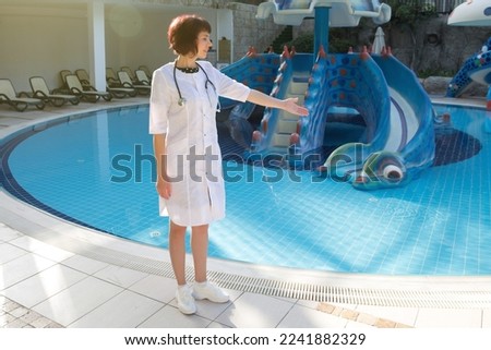 doctor checked water in children's pool. Children holiday safety concept.,