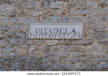 Historic symbol of Budva on wall of the ancient Citadel in the Old City of Budva in Montenegro, Adriatic Mediterranean Sea, Montenegro, Balkan Peninsula, Europe. Summer vacation tranquil atmosphere