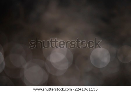 Light abstract dark bokeh christmas circle color glitter blurred black background