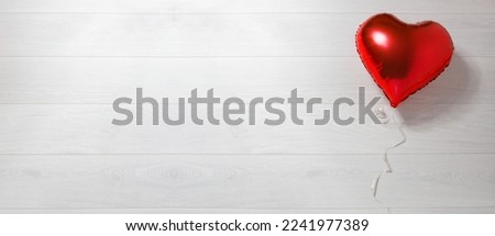 Banner Valentine red heart shape balloon on white wooden background. Top view, copy space valentine's concept. Romantic love holiday gift accessories. Mockup template blank desktop