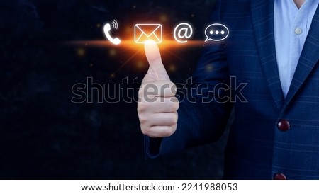 Contact us or Customer support hotline people connect. Businessman using showing and touching on virtual screen contact icons ( call phone, email, address, live chat, )