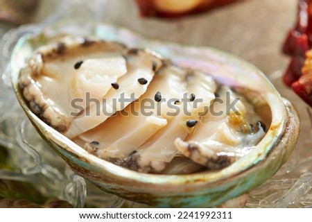 Abalone, thinly sliced raw abalone Royalty-Free Stock Photo #2241992311