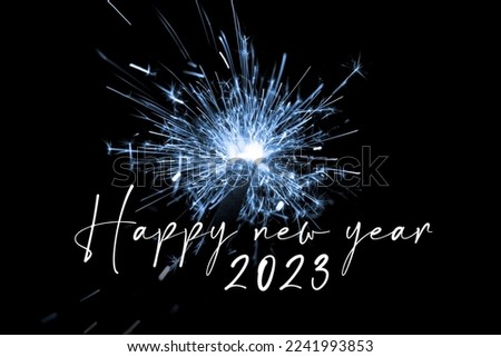 Happy new year 2023 blue sparkler new years eve countdown. Luxury entertainment celebration turn of the year party time. Premium nightlife visual with glowing light sparks on dark background