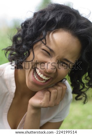 Young woman laughing, portrait