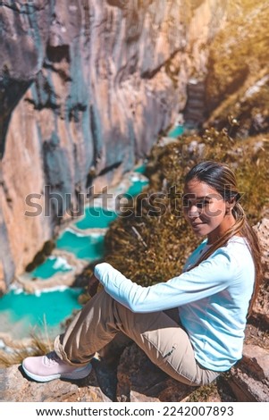 Young woman at viewpoint of the natural pools of Millpu, Ayacucho, Peru. Concept about travel