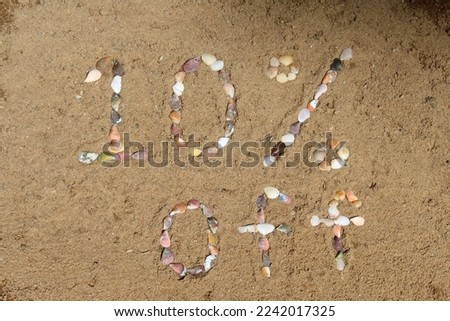A 10% sales profit mark made from shells