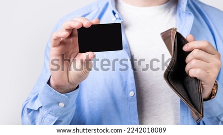 credit or debit card and wallet in hand. photo of credit or debit card with copy space.
