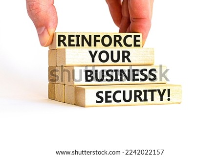Reinforce your business security symbol. Concept word Reinforce your business security on blocks. Beautiful white table white background. Business reinforce your business security concept. Copy space.