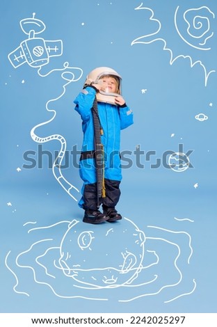 Creative design with drawn elements. Portrait of little boy, child in costume of astronaut over blue background. Future profession. Concept of imagination, childhood, creativity, dreams, ad