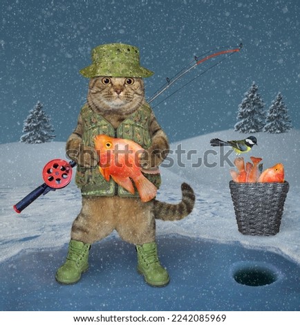 A beige cat fisher with a rod holds a goldfish on the frozen lake during winter fishing.
