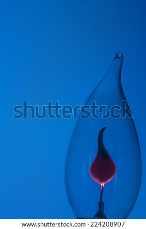 Lightbulb against blue background, close-up