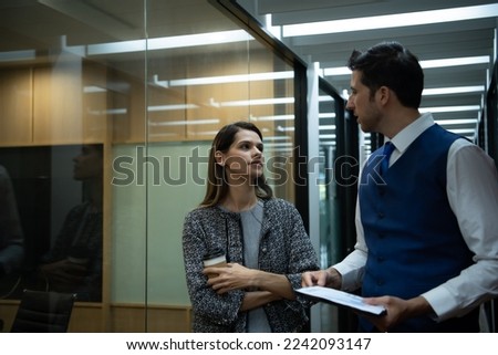 Two young business in the corridor of the conference room Rehearse information to present results and new projects to the management team for consideration. Royalty-Free Stock Photo #2242093147