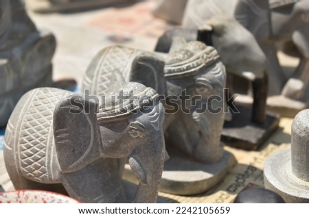 A closeup selective focus picture of Elephant Sculptures made of slate stone for Sale in India