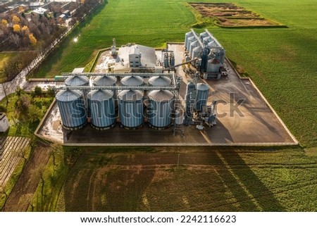 aerial view on agro-industrial complex with silos and grain drying line