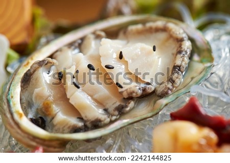 Abalone, thinly sliced raw abalone Royalty-Free Stock Photo #2242144825