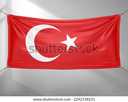 Turkey national flag cloth fabric waving on beautiful grey sky.