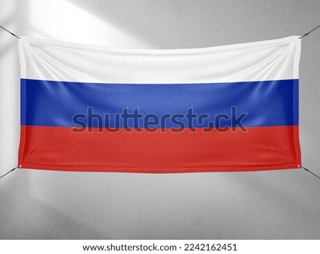 Russia national flag cloth fabric waving on beautiful grey sky.