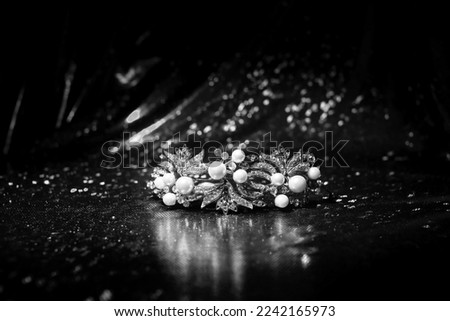 Royal luxury diadem, crown with pearls on red background. Princess and queen. Black and white