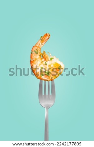 Baked shrimp on a fork isolated on a blue background, grilled shrimp on a fork. Poster for a restaurant Royalty-Free Stock Photo #2242177805