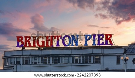 View of Brighton Pier sign near the waterfront in Brighton, UK