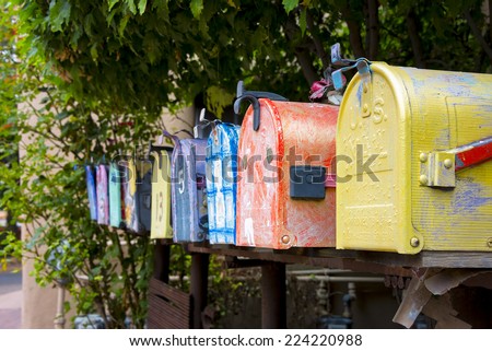 Colorful antique mailboxes on Canyon Road in Santa Fe, NM Royalty-Free Stock Photo #224220988