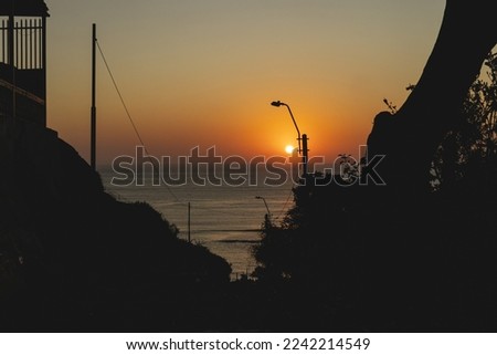 View of Catalina Recavarren viewpoint, near Barranco beach and a beautiful sunset, located in Barranco, Lima - Peru Royalty-Free Stock Photo #2242214549