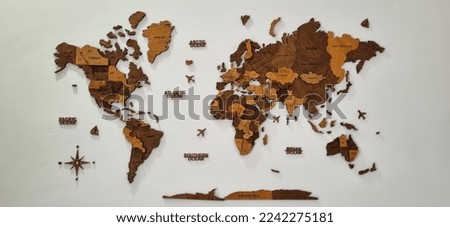 Brown Wooden world maps on the white wall