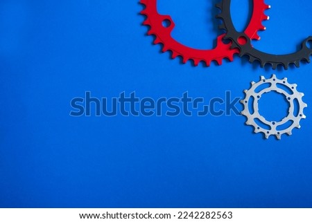Bicycles parts on blue background with space for fill text