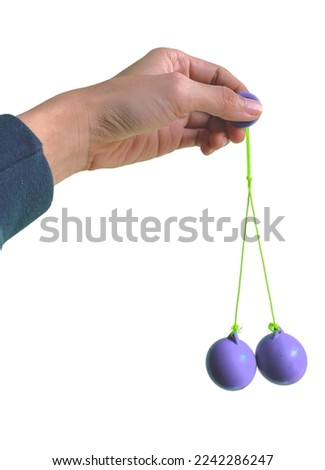 Lato-lato is a type of traditional game that can be found in Indonesia. These lato-lato have been very iconic since the 1990s, especially for people who live in rural areas Royalty-Free Stock Photo #2242286247