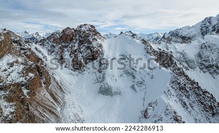 panoramic view of snowy mountain peaks. mountain gorge. glaciers, permafrost