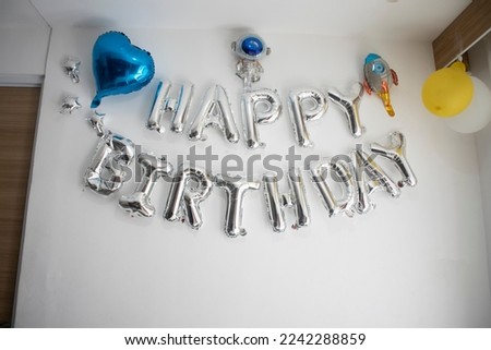 Aluminum foil balloons for Birthday party banner hanging on the wall, happy birthday balloon