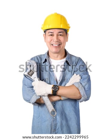 Asian tradesman holding adjustable wrench and crossed arms isolated on white background. Royalty-Free Stock Photo #2242299965