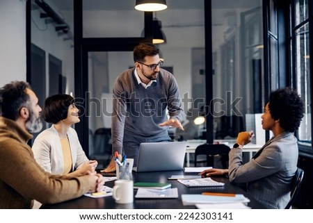 A focused businessman is having presentation about project at the office. Royalty-Free Stock Photo #2242303141