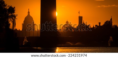 Washington D.C. - Sunrise at Lincoln Memorial with silhouettes of Capitol Building and Washington Monument 