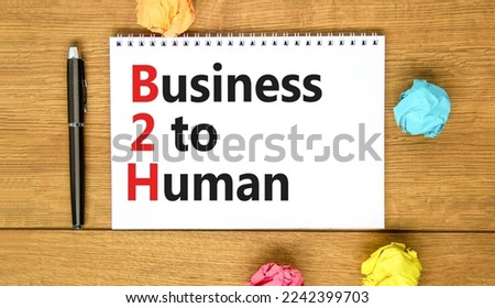 B2H business to human symbol. Concept words B2H business to human on white note on a beautiful wooden background. Business and B2H business to human concept. Copy space.