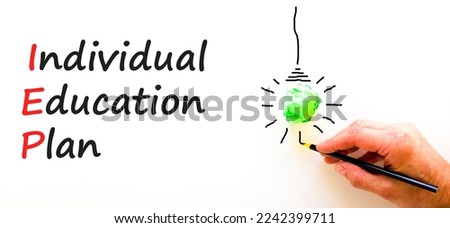 IEP individual education plan symbol. Concept words IEP individual education plan on paper on a beautiful white background. Light bulb icon. Business IEP individual education plan concept. Copy space