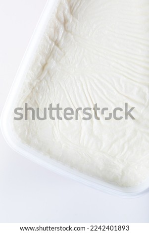 Traditional creamy yoghurt. Turkish and Greek traditional dairy food yogurt or yoghurt in a white bowl.