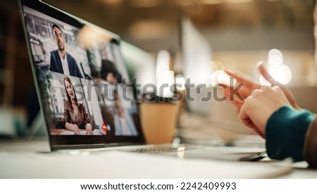 Multiethnic People Conference Meeting Online and Discussing Business Project. Laptop Screen Containing a Group Video Call. Colleagues Working From Home and Collaborating on Internet Royalty-Free Stock Photo #2242409993