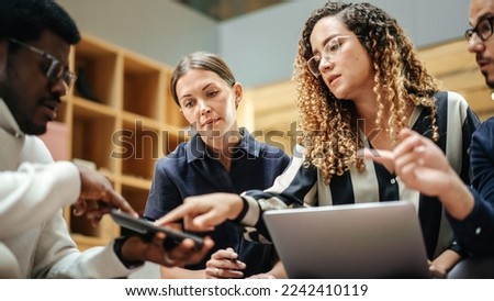 Diverse Group of People Talking in a Casual Modern Meeting Room in Office. Group of Colleagues From Different Ethnicities Working Together as a Team on Crisis Management. Wide Shot Royalty-Free Stock Photo #2242410119