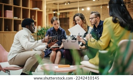 Female Manager Leading a Meeting About Sustainability and Ethnicity with her Multiethnic Teammates. Young Group of Employees Presenting Their Project Ideas To Startup CEO. Medium Shot Royalty-Free Stock Photo #2242410145