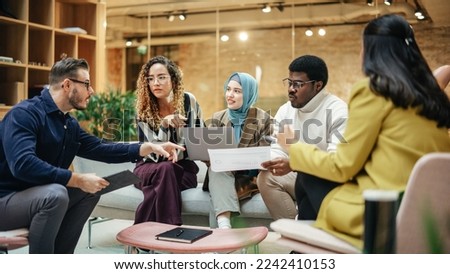 Multiethnic Group of People Use Tablet, Laptop and Statistics Data to Discuss Work in Office Conference Meeting Room. Diverse Colleagues Solving Problems, Teamwork leads to Great Result Royalty-Free Stock Photo #2242410153
