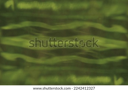blurred abstract background. green waves.