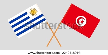 Crossed flags of Uruguay and Tunisia. Official colors. Correct proportion. Vector illustration
