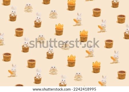 Seamless pattern made of little white rabbits on pastel background. Symbol of the Chinese New Year of the rabbit. Happy 2023 and good luck!